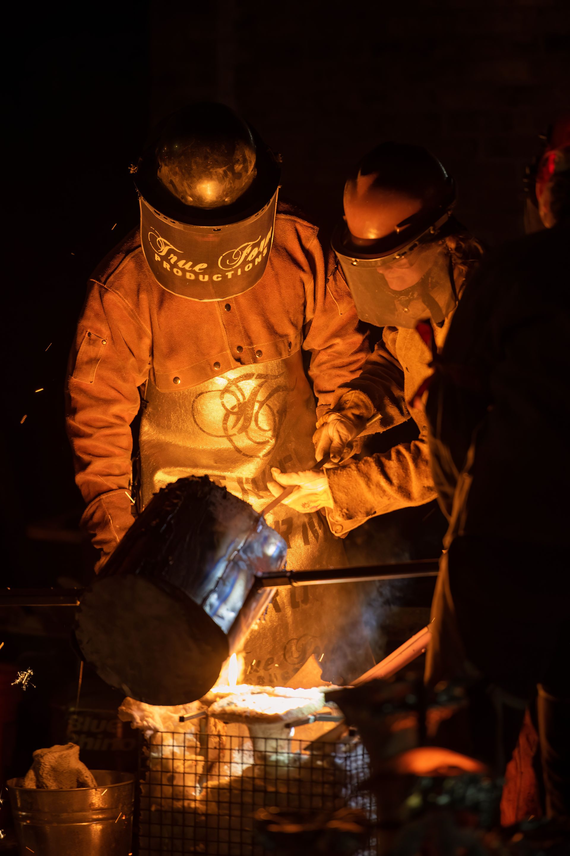 Molten metal being poured during casting production